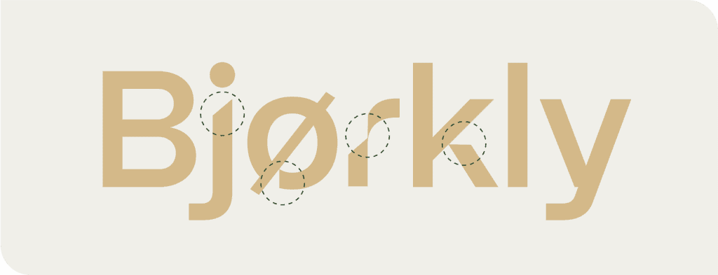 Tekstlogoen "Bjørkly" i en moderne beige skrifttype på lys bakgrunn, med prikkede sirkler som markerer deler av bokstavene "B", "j", "ø", "r" og "k".